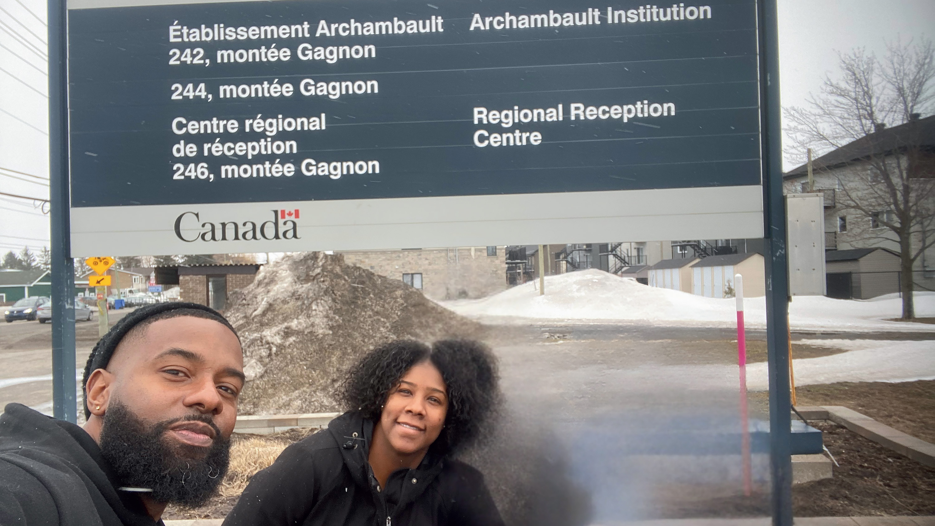 Svens Télémaque and Amanda Maxwell in front of the Regional Reception Centre at Archambault Institution.